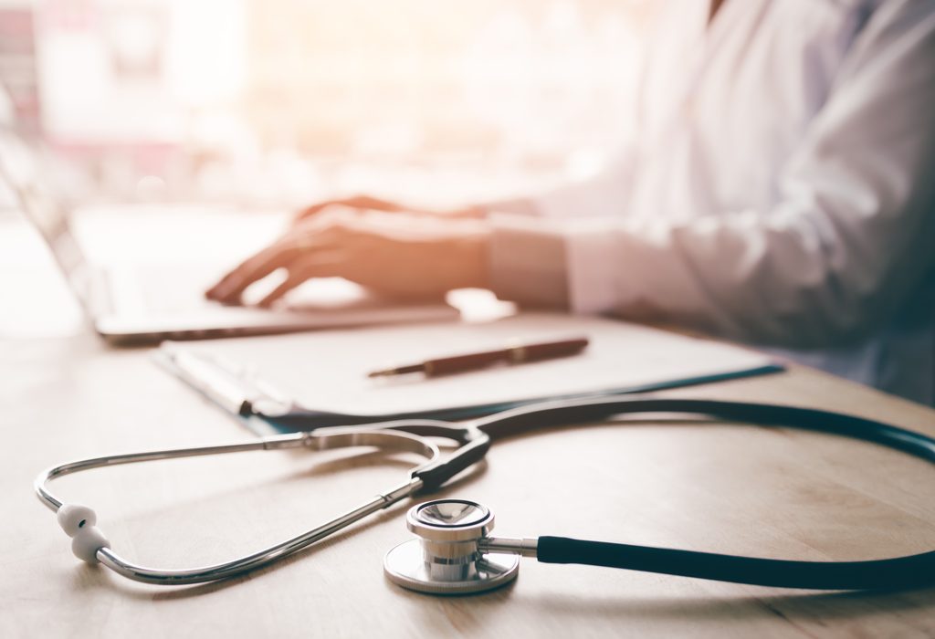 A Snap Diagnostics provider reviews home sleep test results in a clinical setting.